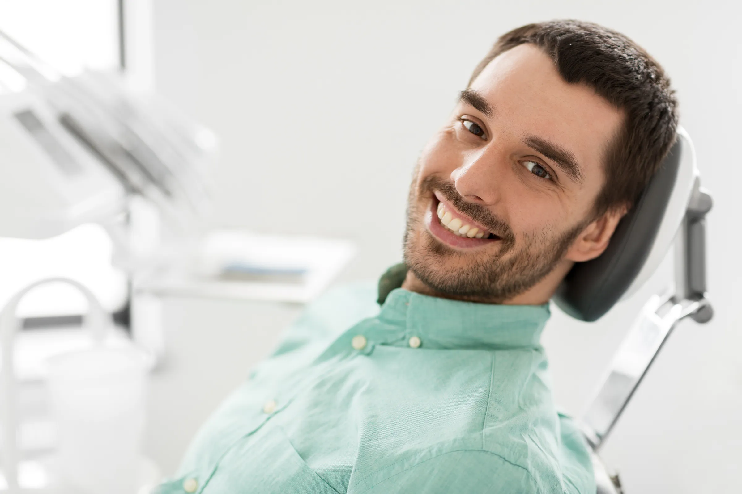 Smiling man relaxing in a dental chair