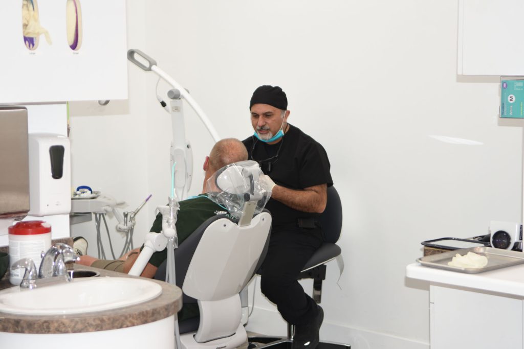 Dr. Haroonian treating a patient