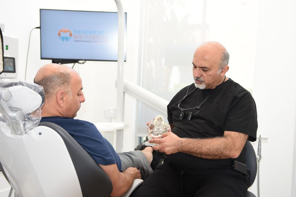 Dr. Haroonian with a patient in the treatment room