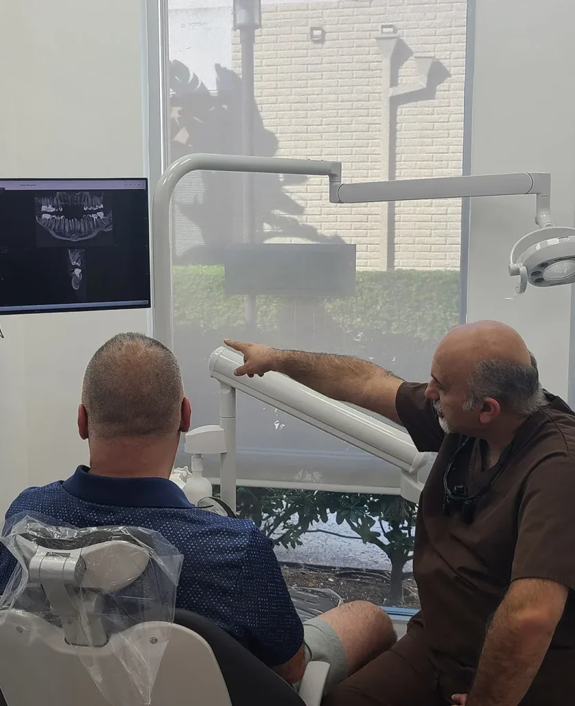 Dr. Haroonian talking with a patient