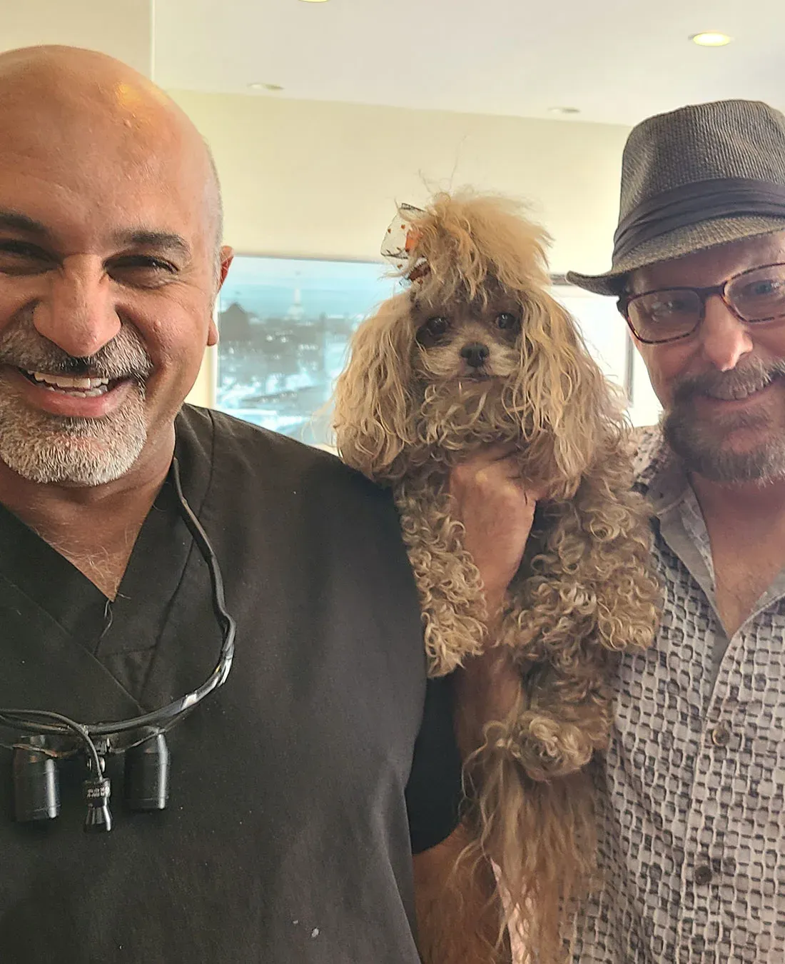 Dr. Haroonian with a patient and his dog